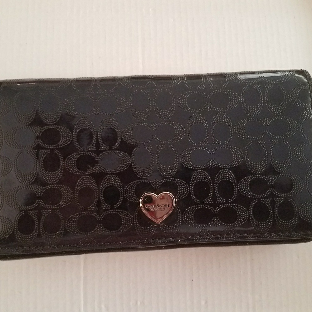 Coach perforated liquid gloss clutch